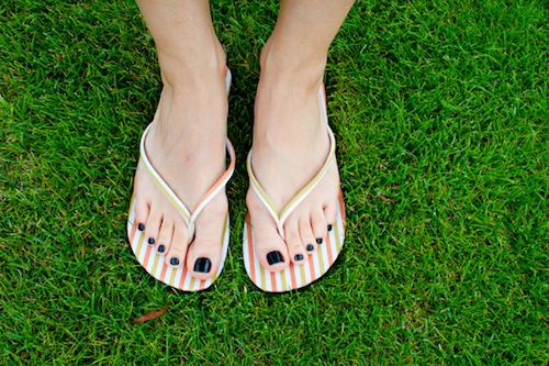 woman-wearing-sandals-nail-polish