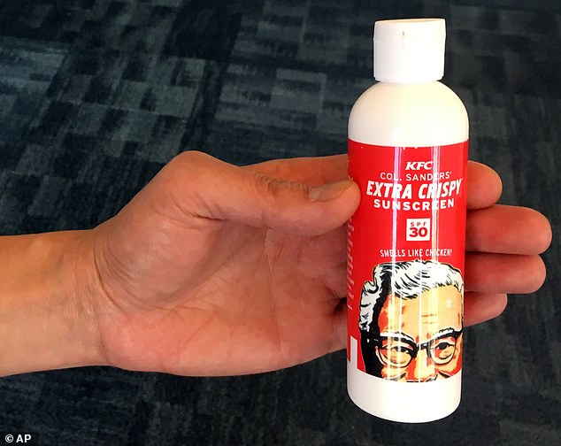 A bottle of Extra Crispy Sunscreen is modeled, Monday, Aug. 22, 2016, in New York. On Monday, KFC gave away 3,000 bottles of the lotion to drum up buzz for its Extra Crispy chicken. KFC, which is owned by Louisville, Ky.-based Yum Brands Inc., said that it was out of the bottles a few hours after they appeared on its website. (AP Photo/Swayne B. Hall)