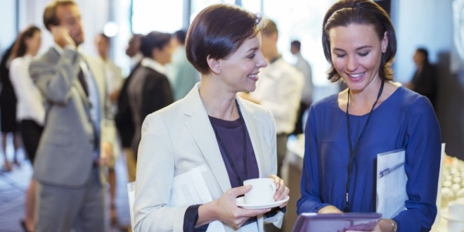 portrait-of-two-smiling-women-talking-in-lobby-of-conference-center-during-coffee-break-530686107-570eb3b43df78c7d9e57e7f0